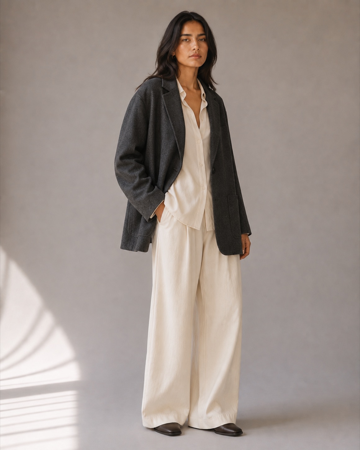 A model in the Rowan Relaxed Blazer over ivory trousers